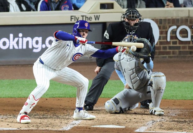 Cubs center fielder Pete Crow-Armstrong bunts and grounds out in...