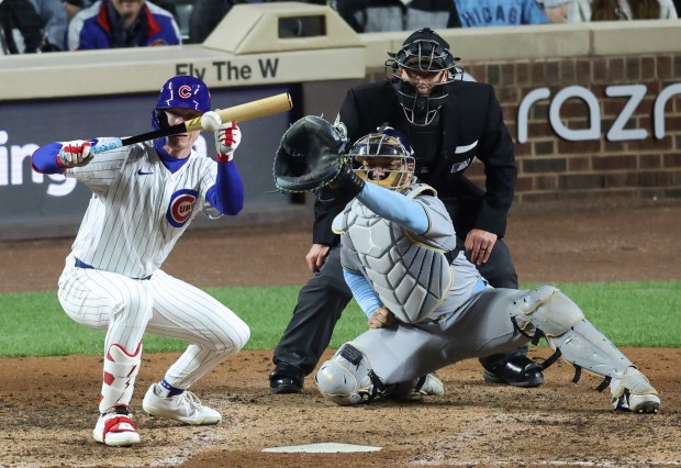 Cubs center fielder Pete Crow-Armstrong hits a sacrifice bunt to...
