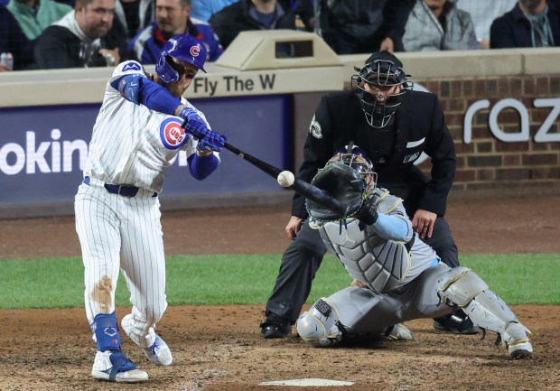 Cubs first baseman Michael Busch connects for a solo home...
