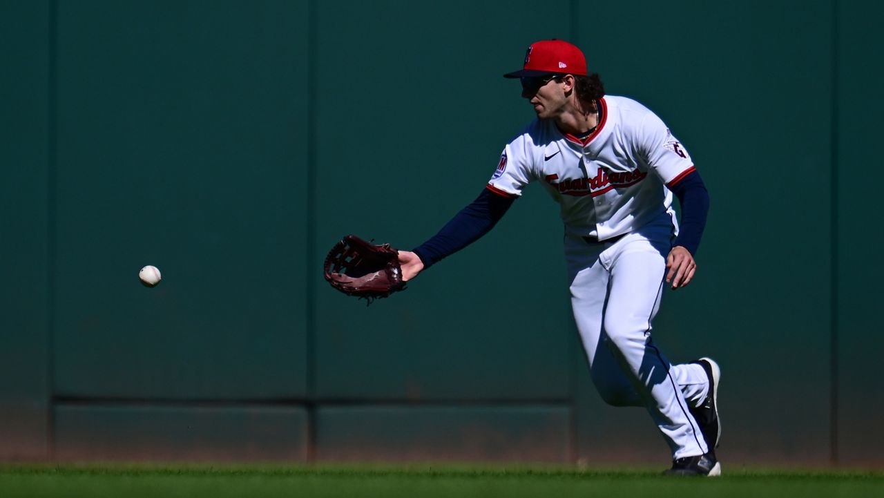 Cleveland Guardians center fielder Chase DeLauter misses a ball hit by Detroit Tigers' Gleyber Torres for a fielding error in the first inning of Game 2 of the American League Wild Card baseball playoff series in Cleveland, Wednesday, Oct. 1, 2025.