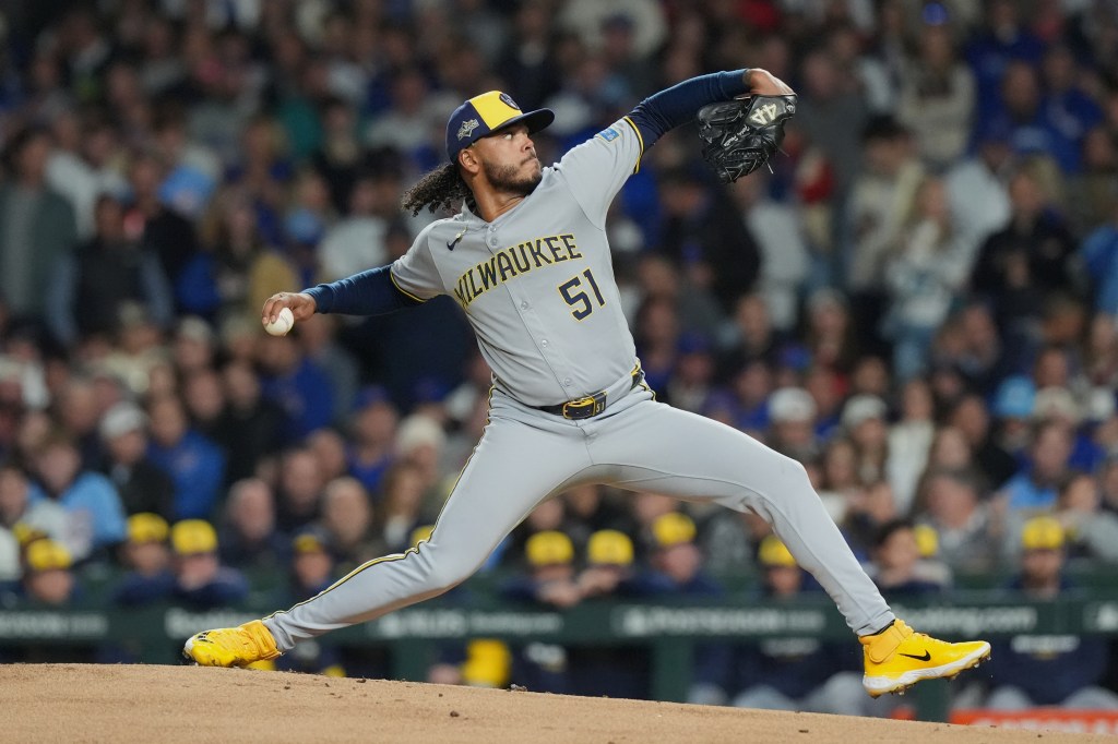 Milwaukee Brewers pitcher Freddy Peralta delivering a pitch.