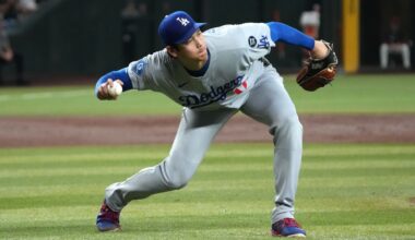 Los Angeles Dodgers pitcher Shohei Ohtani fields the ball hit by Arizona Diamondbacks' Alek Thomas in the third inning of a baseball game on Tuesday in Phoenix. (AP Photo/Rick Scuteri)