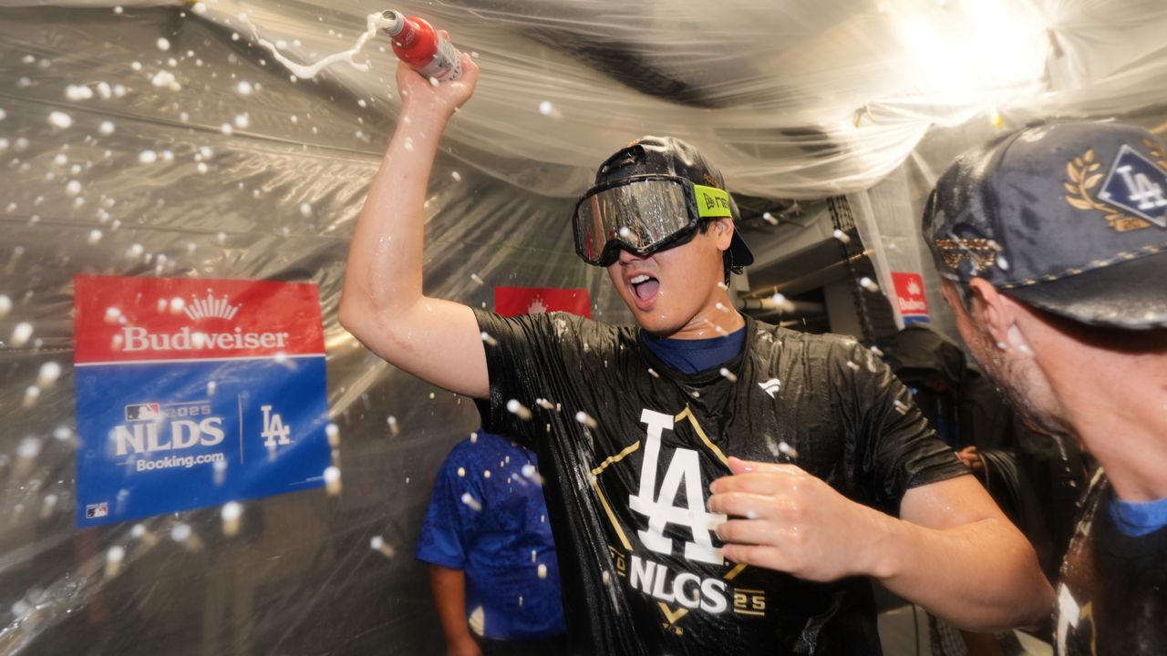 Los Angeles Dodgers' Shohei Ohtani celebrates after his team's win over the Philadelphia Phillies in Game 4 of baseball's National League Division Series on Thursday in LA. (AP Photo/Jae C. Hong)