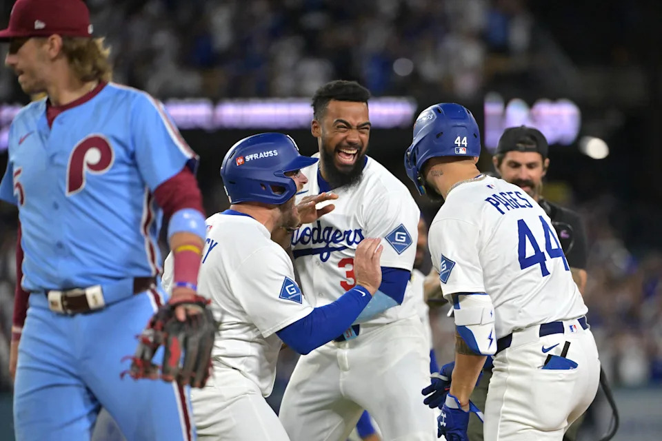 Oct 9, 2025; Los Angeles, California, USA; Los Angeles Dodgers third baseman Max Muncy (13), right fielder Teoscar Hern‡ndez (37) and center fielder Andy Pages celebrate after defeating the Philadelphia Phillies in game four of the NLDS round for the 2025 MLB playoffs at Dodger Stadium. Mandatory Credit: Jayne Kamin-Oncea-Imagn Images