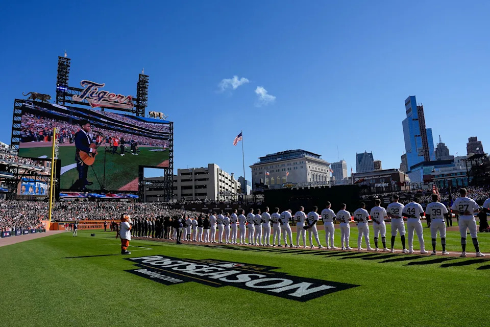 Detroit Tigers and Cleveland Guardians players on the field for the national anthem at Game 3 of ALDS at Comerica Park in Detroit on Wednesday, Oct. 9, 2024.