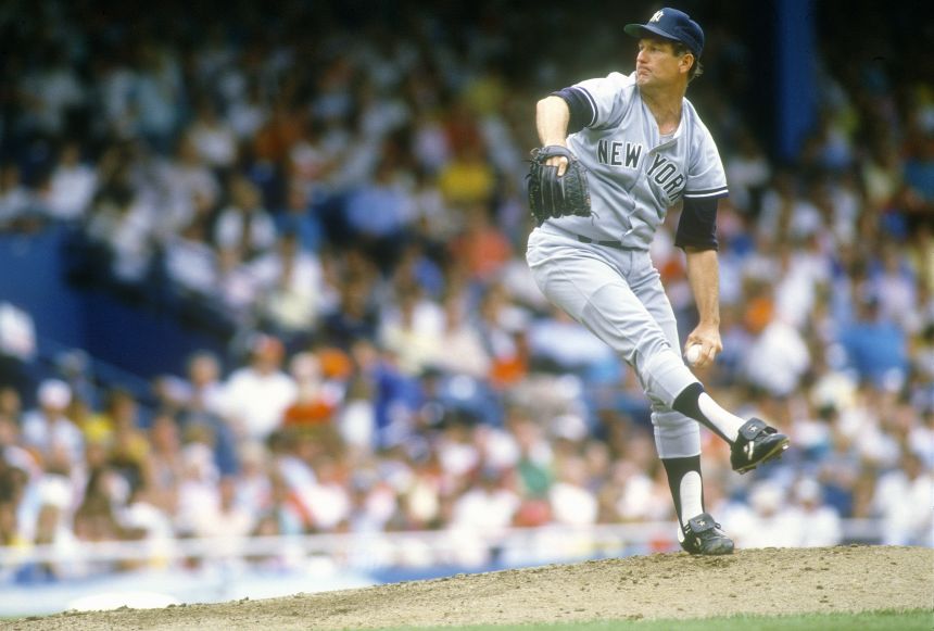 Tommy John pitches for the New York Yankees during the 1980s.