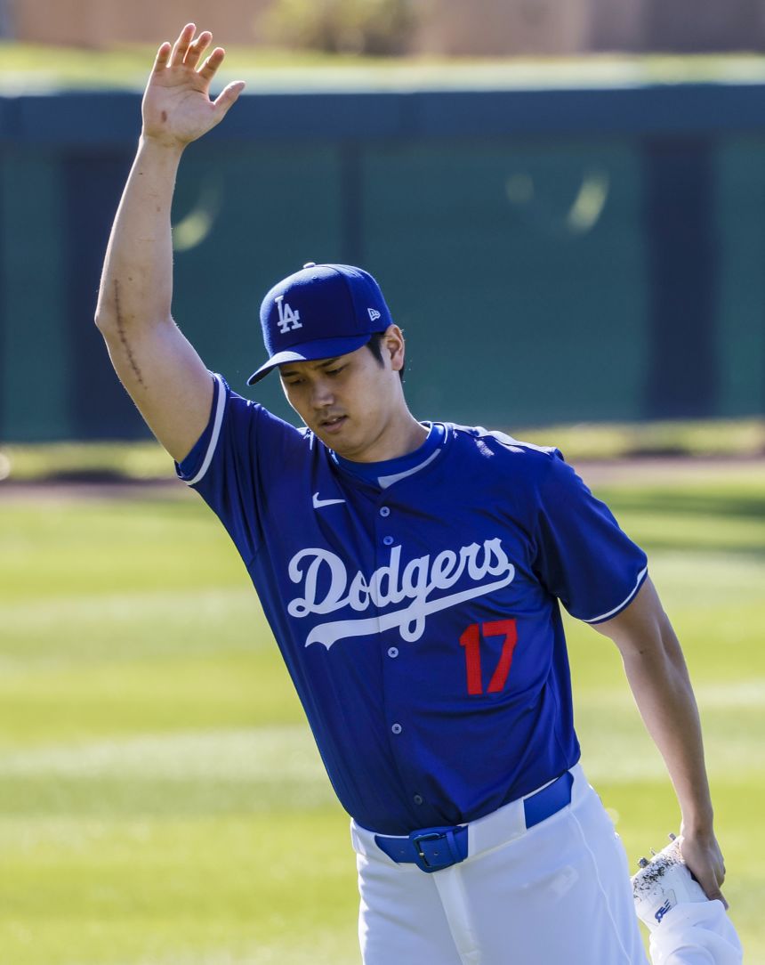The arm of Los Angeles Dodgers star Shohei Ohtani, seen here during spring training last year, bears the scar of Tommy John surgery.