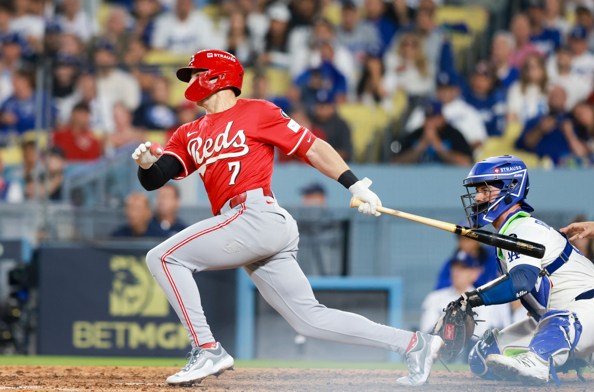LOS ANGELES, CA - SEPTEMBER 30: Spencer Steer #7 of the Cincinnati Reds hits a RBI single in the top of the eighth inning during Game One of the National League Wild Card Series between the Cincinnati Reds and the Los Angeles Dodgers at Dodger Stadium on Tuesday, September 30, 2025 in Los Angeles, California. (Photo by Nicole Vasquez/MLB Photos via Getty Images)