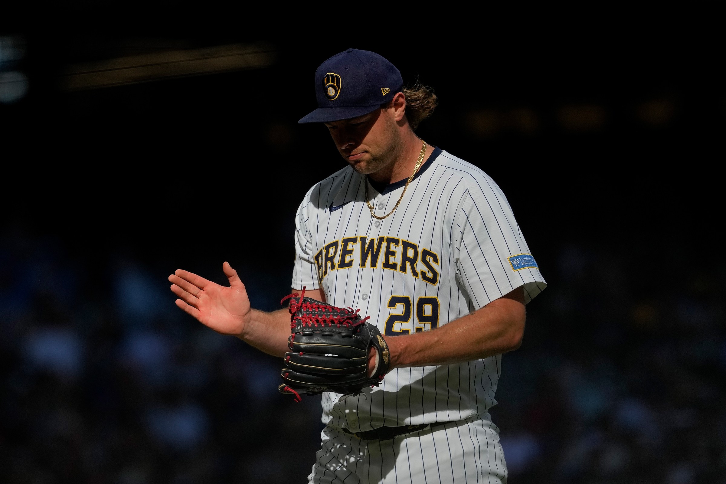 MILWAUKEE, WISCONSIN - SEPTEMBER 28: Trevor Megill #29 of the Milwaukee Brewers walks off the mound during the game against the Cincinnati Reds at American Family Field on September 28, 2025 in Milwaukee, Wisconsin. (Photo by John Fisher/Getty Images)
