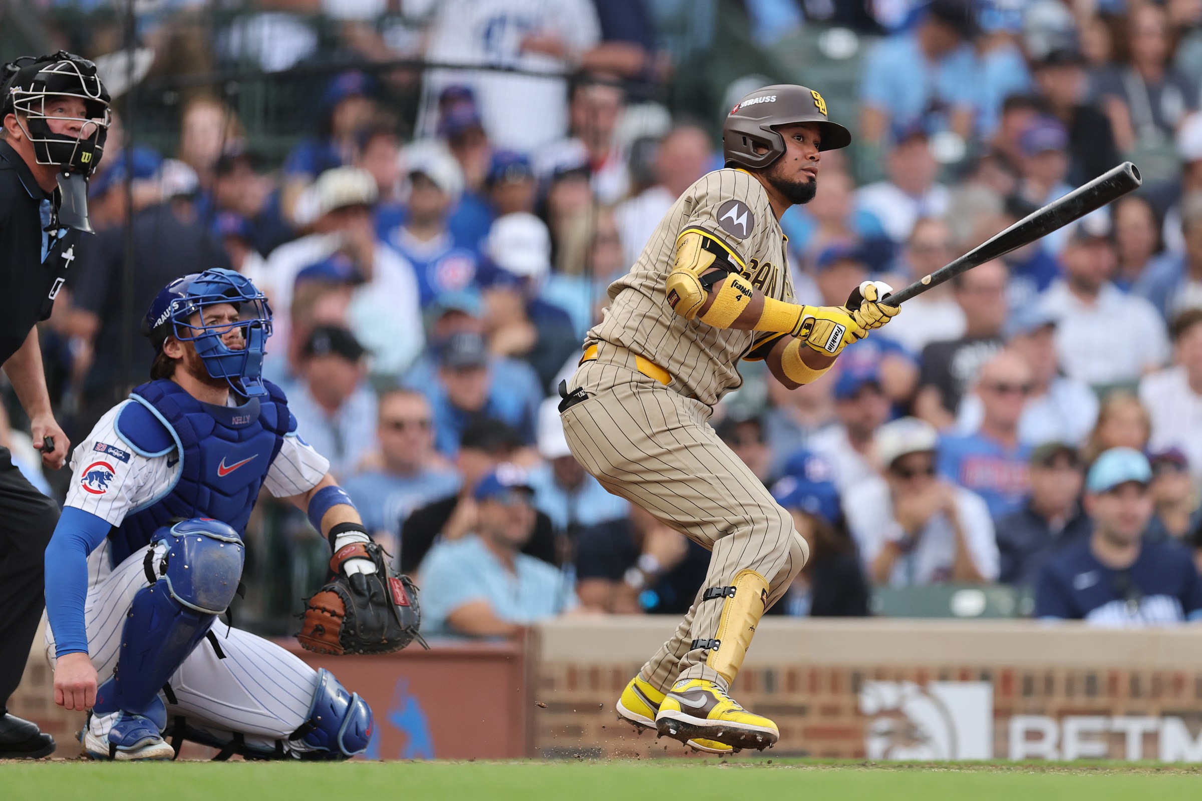 CHICAGO, ILLINOIS - OCTOBER 01: Luis Arraez #4 of the San Diego Padres singles in the seventh inning against the Chicago Cubs during game two of the National League Wild Card Series at Wrigley Field on October 01, 2025 in Chicago, Illinois. (Photo by Michael Reaves/Getty Images)