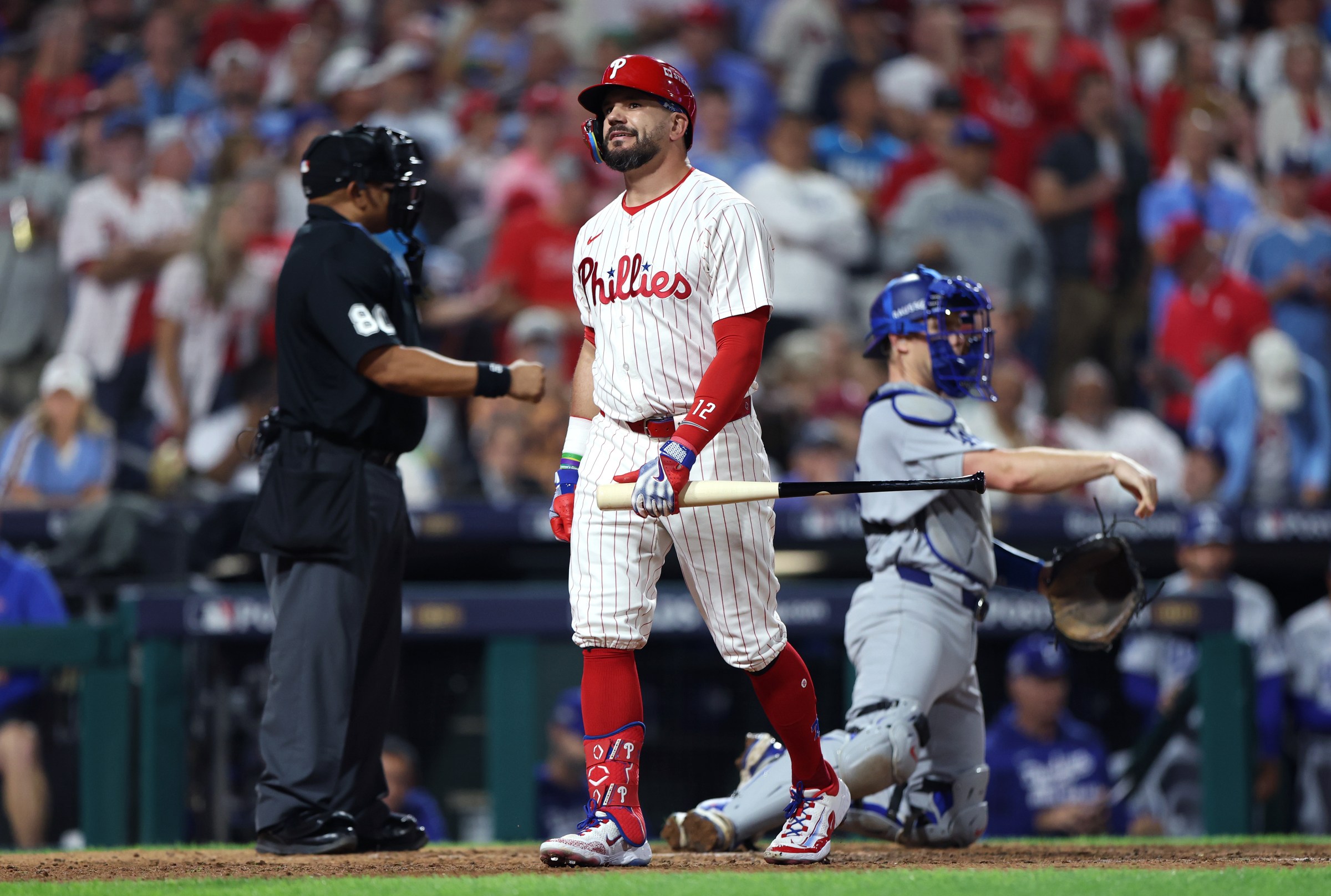 PHILADELPHIA, PENNSYLVANIA - OCTOBER 06: Kyle Schwarber #12 of the Philadelphia Phillies reacts after striking out during the eighth inning against the Los Angeles Dodgers in game two of the National League Division Series at Citizens Bank Park on October 06, 2025 in Philadelphia, Pennsylvania. (Photo by Emilee Chinn/Getty Images)