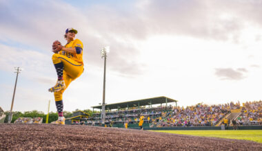 person pitching from a mound