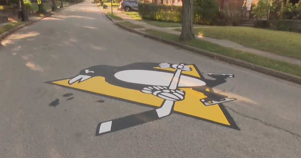 Painting the streets black and gold, Pittsburgh neighborhood shows sports pride in unique way