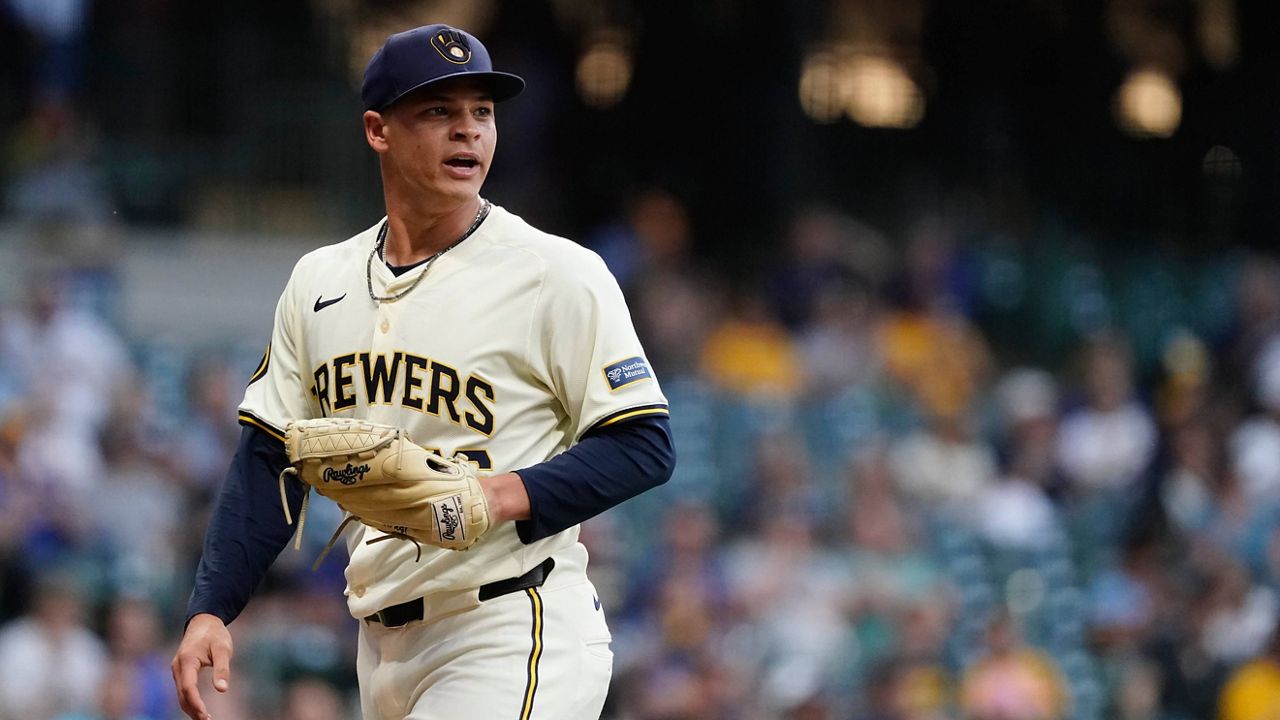 Milwaukee Brewers' Tobias Myers reacts to a defensive play as he walks to the dugout in the fourth inning of a baseball game against the Pittsburgh Pirates, Wednesday, July 10, 2024, in Milwaukee.