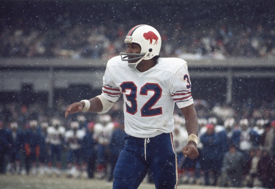 O.J. Simpson #32 of the Buffalo Bills watches the finish of a play at Shea Stadium in Flushing, New York.
