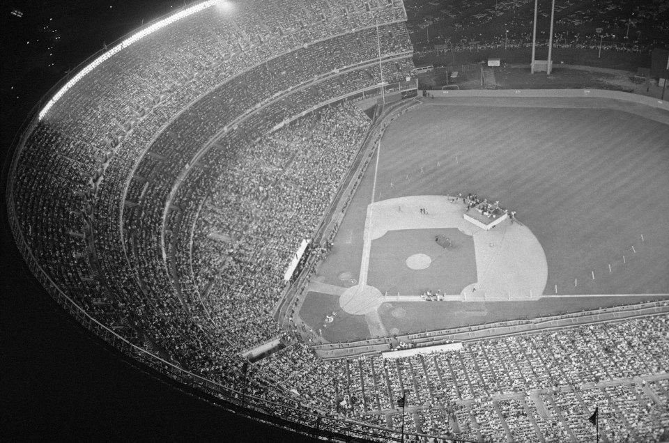 Shea Stadium is jam-packed with Beatles fans during a performance given by the British band