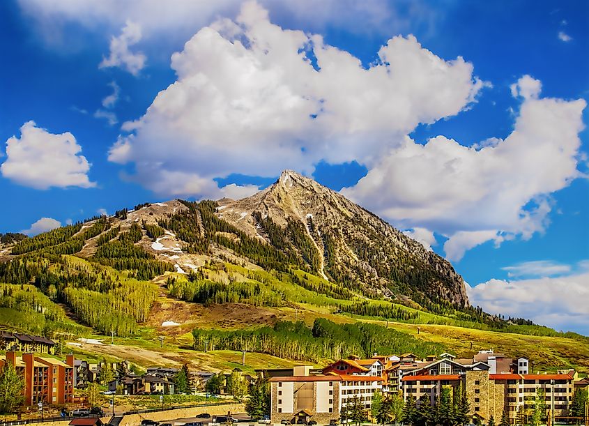 Crested Butte, Colorado, USA. Ski lodges sit at the bottom of a mountain in the springtime.