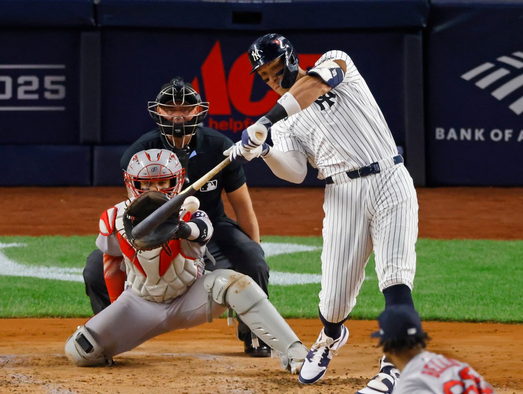 New York Yankees outfielder Aaron Judge (99) singles during the third inning against the Boston Red Sox.