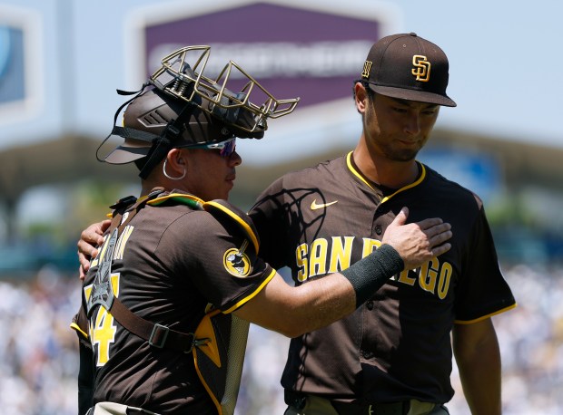 Padres pitcher Yu Darvish and catcher Freddy Fermin head to...