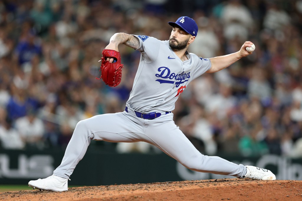 Tanner Scott #66 of the Los Angeles Dodgers pitches during the ninth inning against the Seattle Mariners at T-Mobile Park on September 26, 2025 in Seattle, Washington.