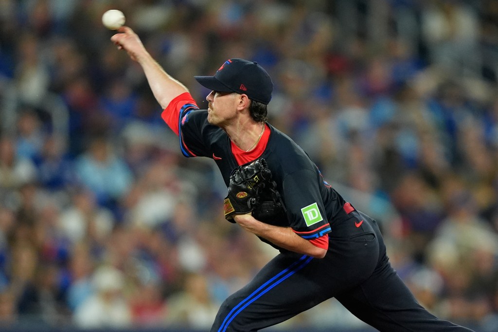 Toronto Blue Jays pitcher Shane Bieber throwing a baseball.