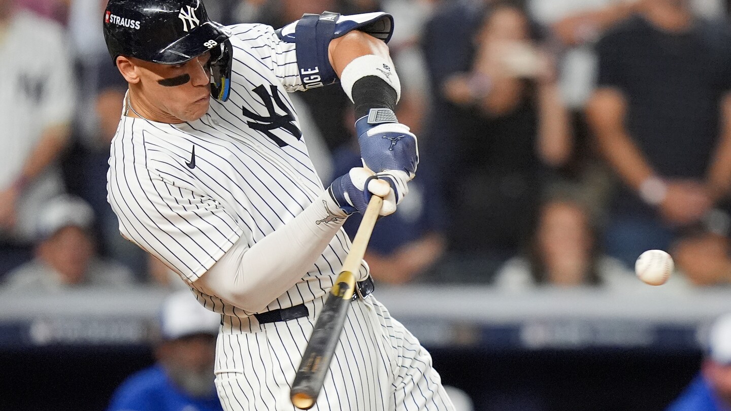 Aaron Judge rallies Yankees past Blue Jays 9-6 to save season and avert ALDS sweep