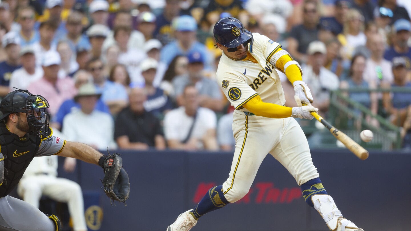 Brewers beat the Pirates 12-5 to extend their winning streak to 12 games.