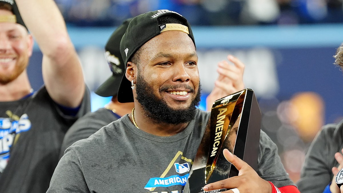 Vladimir Guerrero Jr. holds trophy