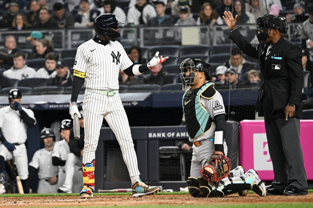 Yankees third base Jazz Chisholm Jr. (13) talks with home plate umpire Malachi Moore during the fourth inning of the Yankees and Arizona Diamondbacks game.