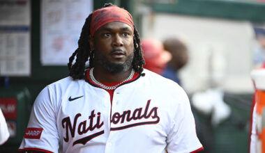 Jul 22, 2025; Washington, District of Columbia, USA; Washington Nationals designated hitter Josh Bell (19) in the dugout after hitting a solo home run against the Cincinnati Reds during the fourth inning at Nationals Park. Mandatory Credit: Brad Mills-Imagn Images