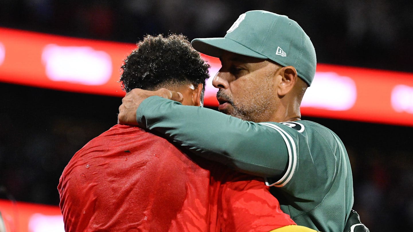 Sep 26, 2025; Boston, Massachusetts, USA; Boston Red Sox manager Alex Cora (right) hugs center fielder Ceddanne Rafaela (3) as they celebrate clinching a playoff spot after defeating the Detroit Tigers in the ninth inning at Fenway Park. Mandatory Credit: Eric Canha-Imagn Images