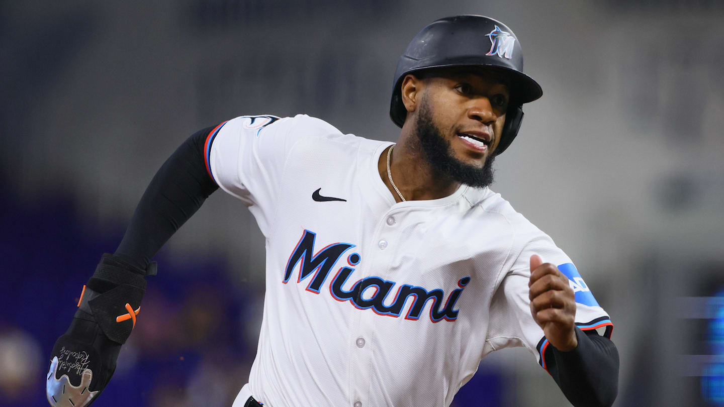 Jun 5, 2024; Miami, Florida, USA; Miami Marlins left fielder Bryan De La Cruz (14) runs toward home plate after an RBI double by right fielder Jesus Sanchez (not pictured) against the Tampa Bay Rays during the first inning at loanDepot Park.