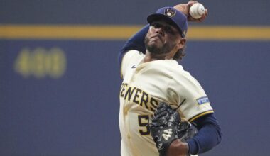 Oct 14, 2025; Milwaukee, Wisconsin, USA; Milwaukee Brewers pitcher Freddy Peralta (51) throws a pitch against the Los Angeles Dodgers in the first inning during game two of the NLCS round for the 2025 MLB playoffs at American Family Field.