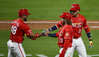 May 23, 2025; St. Louis, Missouri, USA;  St. Louis Cardinals designated hitter Ivan Herrera (48) right fielder Lars Nootbaar (21) and left fielder Brendan Donovan (33) celebrate after they scored on a three run triple by third baseman Nolan Arenado (not pictured) during the sixth inning against the Arizona Diamondbacks at Busch Stadium. Mandatory Credit: Jeff Curry-Imagn Images