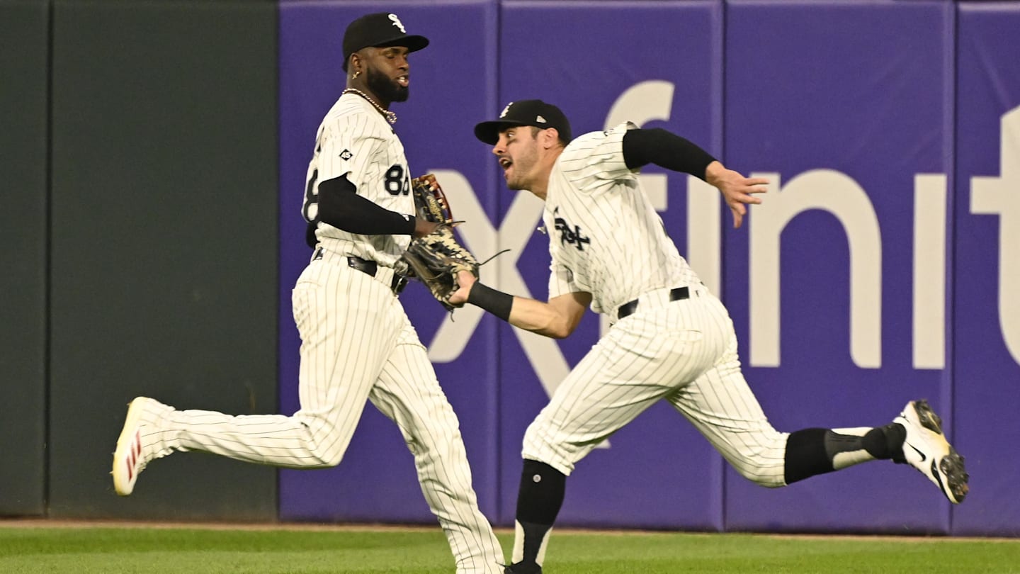Chicago White Sox outfielders Luis Robert Jr. and Mike Tauchman.