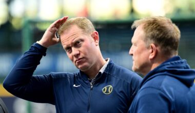 Oct 2, 2024; Milwaukee, Wisconsin, USA; Milwaukee Brewers general manager Matt Arnold talks to manager Matt Arnold before game two of the Wildcard round for the 2024 MLB Playoffs against the New York Mets at American Family Field. Mandatory Credit: Benny Sieu-Imagn Images