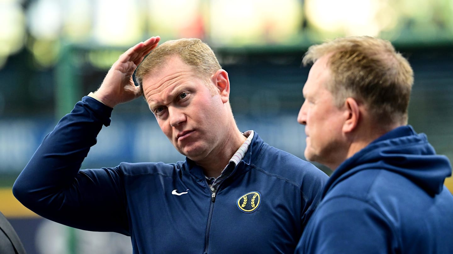 Oct 2, 2024; Milwaukee, Wisconsin, USA; Milwaukee Brewers general manager Matt Arnold talks to manager Matt Arnold before game two of the Wildcard round for the 2024 MLB Playoffs against the New York Mets at American Family Field. Mandatory Credit: Benny Sieu-Imagn Images