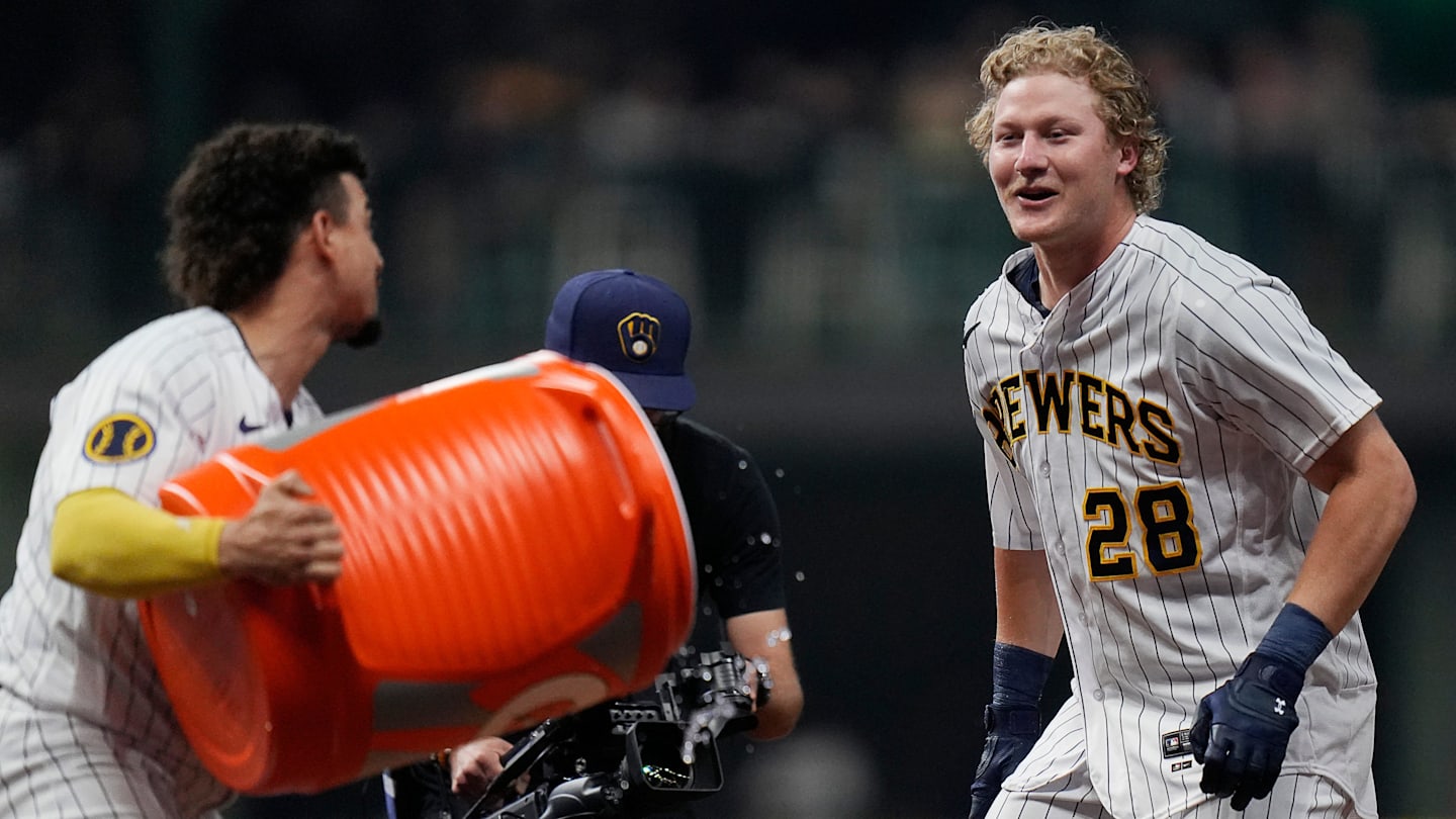 Milwaukee Brewers shortstop Willy Adames (27) dumps gatorade on center fielder Joey Wiemer (28) after he hit a sacrifice fly to Kansas City Royals center fielder Jackie Bradley Jr. (41) allowing Brewers right fielder Brian Anderson (9) to score during the ninth inning on Saturday May 13, 2023 at American Family Field in Milwaukee, Wis.