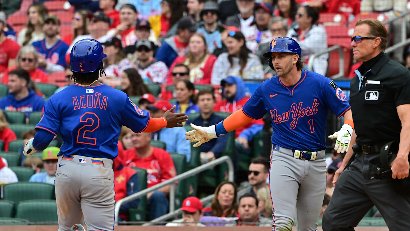 May 4, 2025; St. Louis, Missouri, USA; New York Mets second baseman Luisangel Acuna (2, left) and New York Mets second baseman Jeff McNeil (1) congratulate each other at home plate after scoring in the eighth inning on a single byNew York Mets shortstop Francisco Lindor (12, not shown) at Busch Stadium. Mandatory Credit: Tim Vizer-Imagn Images