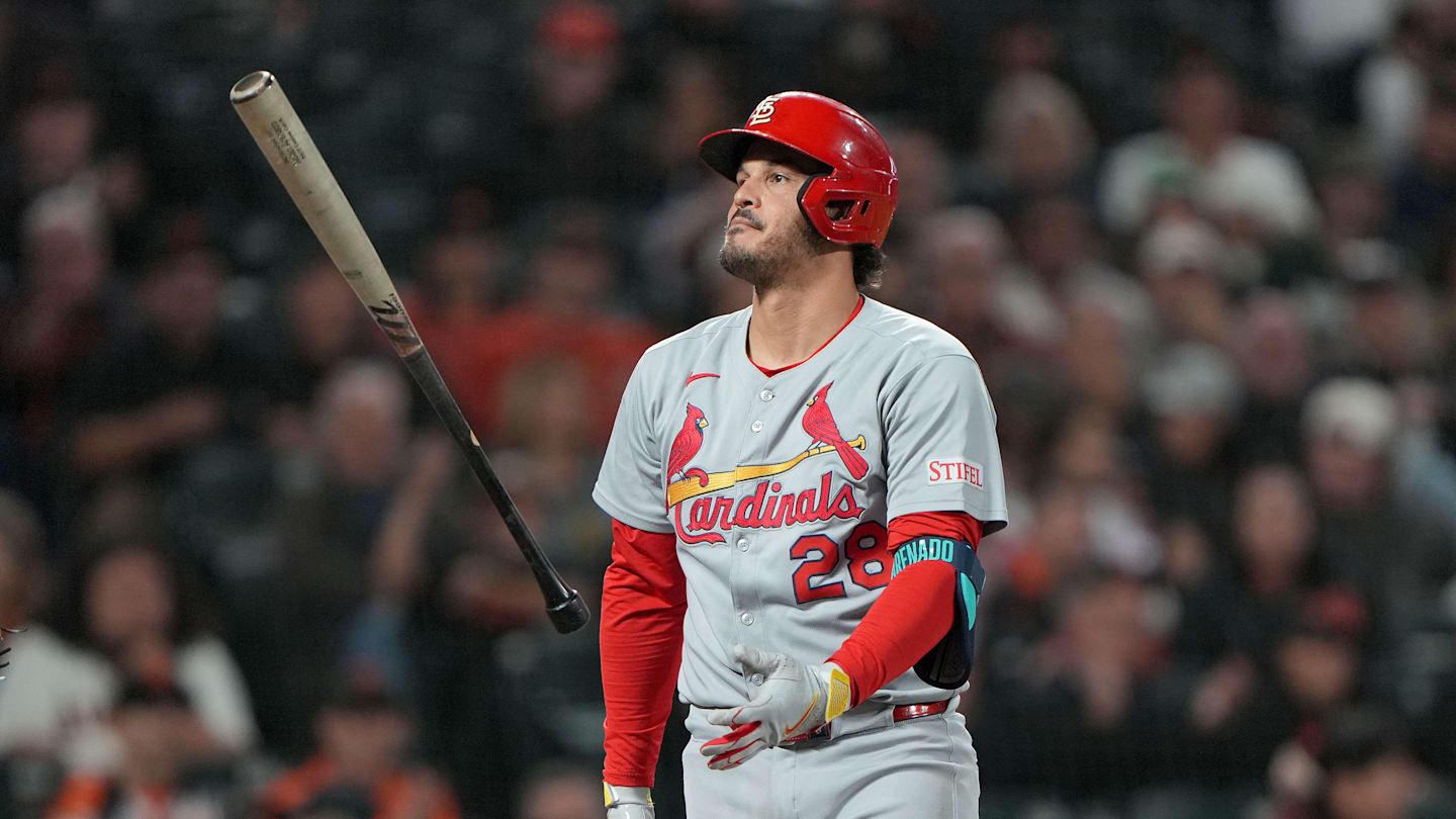 Los Angeles Angels designated hitter Mike Trout looks on from the dugout during the first inning against the Twins