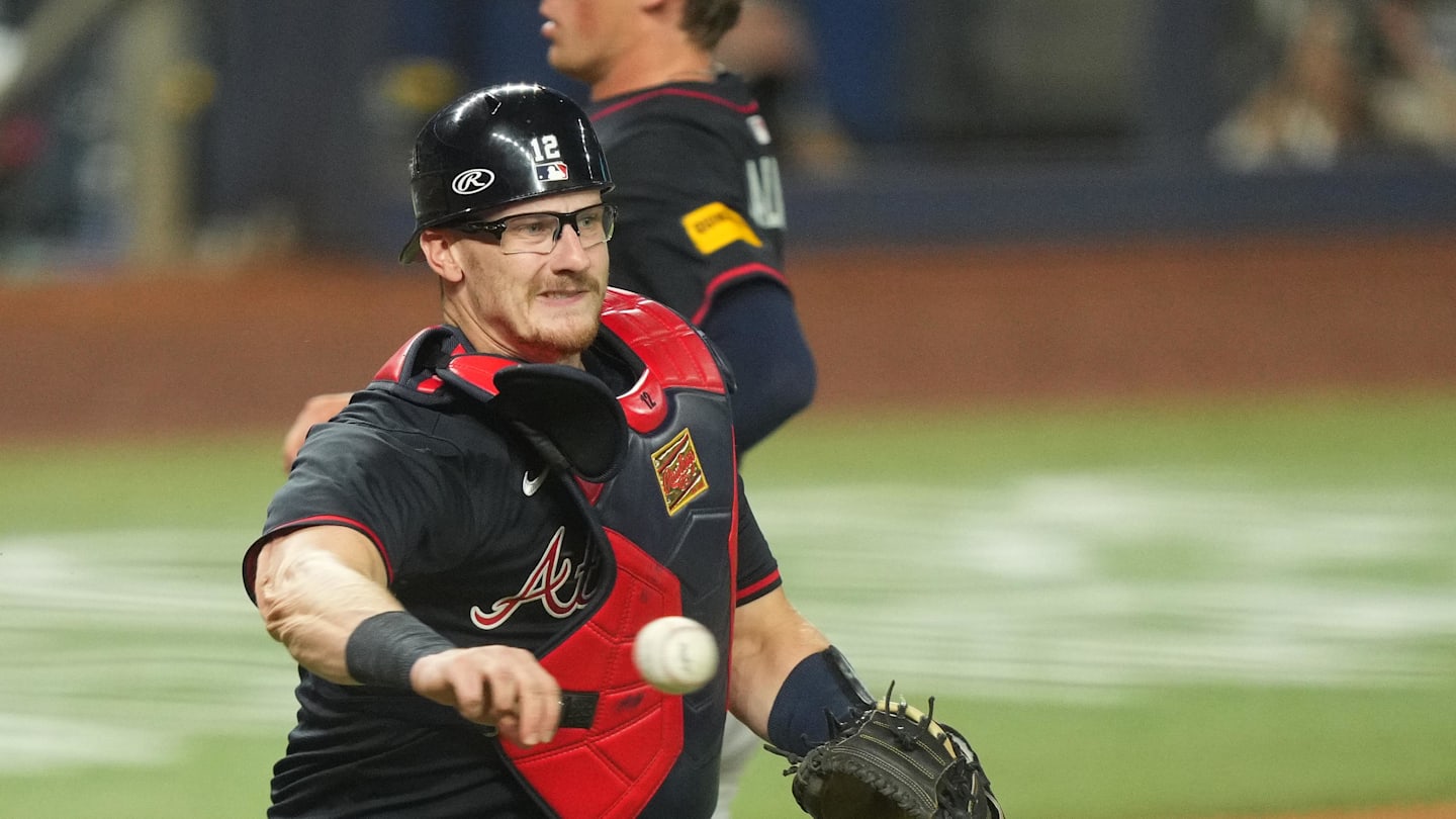 Aug 26, 2025; Miami, Florida, USA;  Atlanta Braves catcher Sean Murphy (12) throws out Miami Marlins right fielder Jakob Marsee (87) in the fifth inning at loanDepot Park. Mandatory Credit: Jim Rassol-Imagn Images