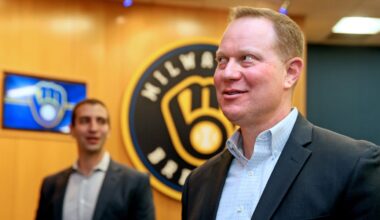 Matt Arnold, right, mingles with others following a press conference where it was announced that he would be taking over the role as president of baseball operations for the Milwaukee Brewers on, October 27, 2022. David Stearns, left, who joined the organization in October 2015 as general manager and was named president of baseball operations prior to the 2019 season, said he would be stepping down.