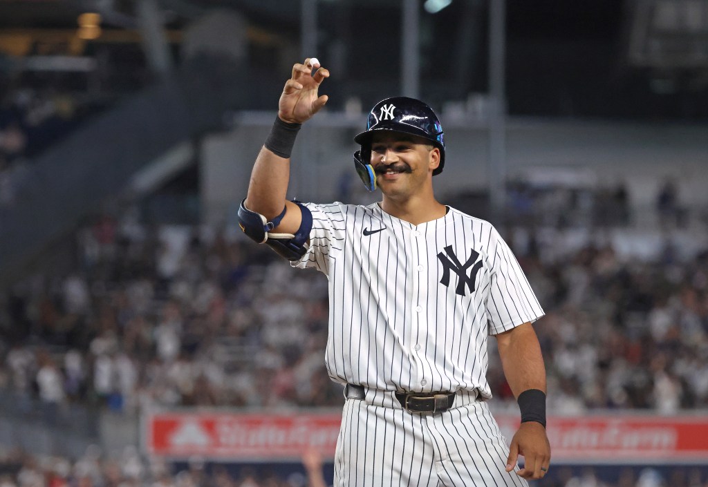 Trent Grisham #12 of the New York Yankees reacts after he hits an RBI single during the 7th inning. 
