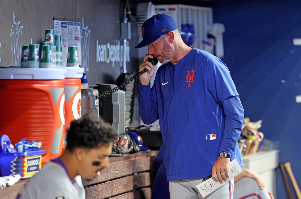 New York Mets pitching coach Jeremy Hefner on the bullpen phone during the 8th inning.