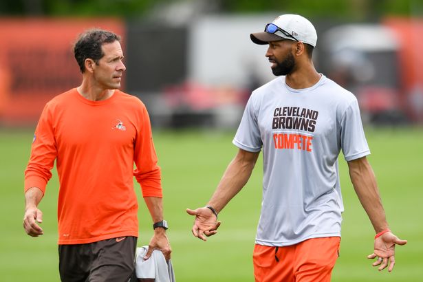 BEREA, OH - MAY 25: Chief strategy officer Paul DePodesta (L) and general manager Andrew Berry of the Cleveland Browns talk after the Cleveland Browns OTAs at CrossCountry Mortgage Campus on May 25, 2022 in Berea, Ohio. (Photo by Nick Cammett/Diamond Images via Getty Images)