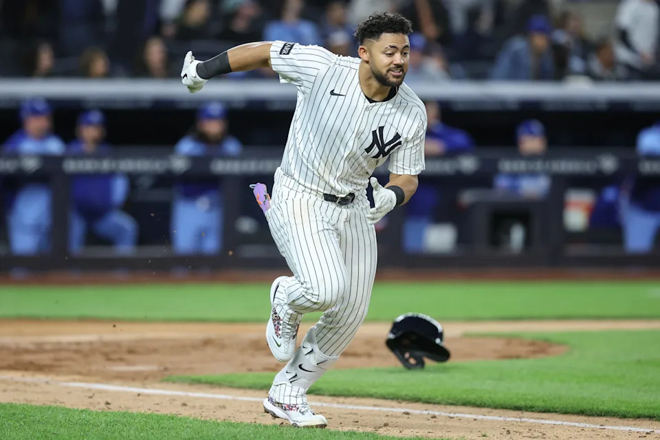 New York Yankees left fielder Jasson Dominguez (24) hits a three run double in the sixth inning against the Kansas City Royals at Yankee Stadium. All players wore #42 for Jackie Robinson Day.