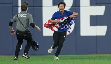 A World Series fan waving an American flag invaded the field in Toronto on Friday night