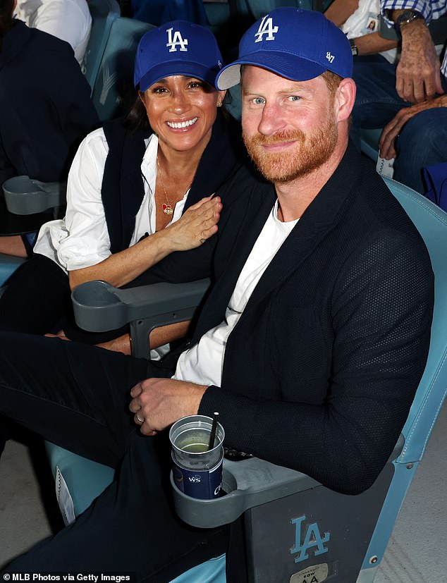 Harry and Meghan pose for a photo during Game Four of the 2025 World Series presented by Capital One between the Toronto Blue Jays and the Los Angeles Dodgers at Dodger Stadium on Tuesday, October 28