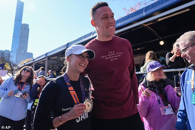 Judge and Samantha were all smiles as she posed with a medal around her neck