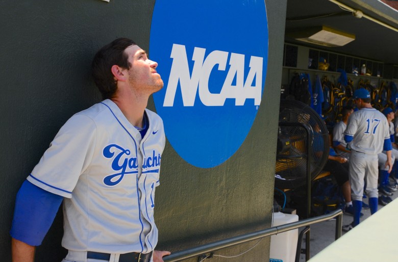 Shane Bieber, in the dugout during the 2016 College World Series, remained at UCSB without a scholarship for two seasons before leading the Gauchos to Omaha in his junior year.